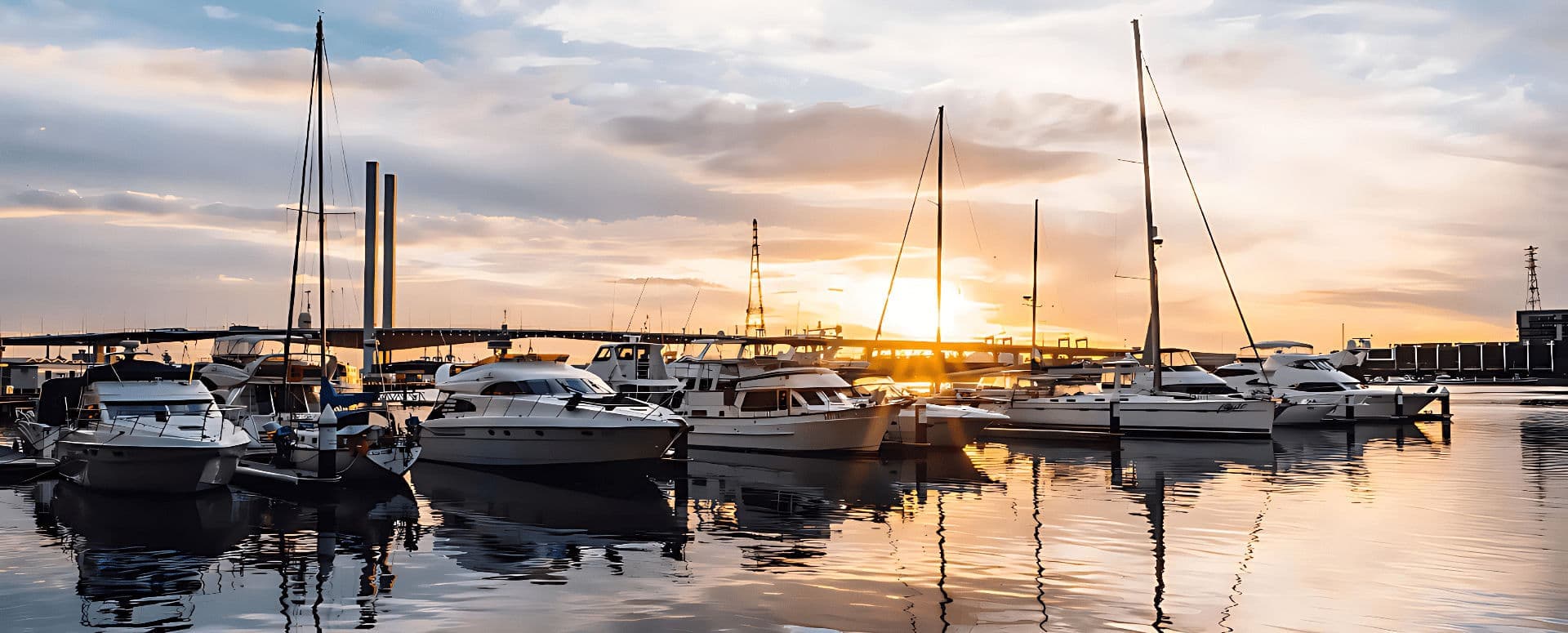 Image of a maritime marina with ships, scaffolding, and security barriers